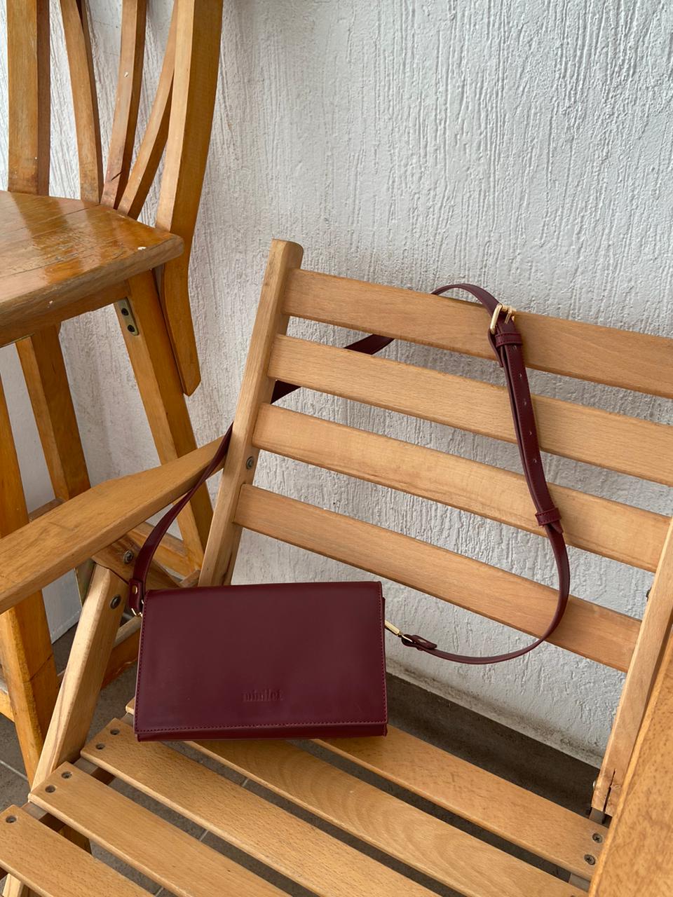 Burgundy | The triangular crossbody Bag